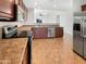 Well-equipped kitchen, featuring granite countertops and stainless steel appliances at 6038 S Connie Ln, Gilbert, AZ 85298