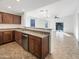 Modern kitchen with stainless steel appliances and wood cabinets at 6038 S Connie Ln, Gilbert, AZ 85298