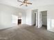 Bright and airy main bedroom with carpeted floors and ample space at 6038 S Connie Ln, Gilbert, AZ 85298