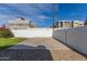 Large backyard with grassy area and gate access at 6808 E Loma Land Dr, Scottsdale, AZ 85257