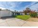 Large backyard with grassy area and home view at 6808 E Loma Land Dr, Scottsdale, AZ 85257