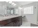 Bathroom boasts double vanity and updated fixtures at 6808 E Loma Land Dr, Scottsdale, AZ 85257