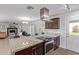 Open kitchen features granite island and stainless steel appliances at 6808 E Loma Land Dr, Scottsdale, AZ 85257