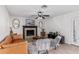 Living room with fireplace, hardwood floors, and French doors at 6808 E Loma Land Dr, Scottsdale, AZ 85257
