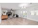 Living room with fireplace, hardwood floors, and French doors at 6808 E Loma Land Dr, Scottsdale, AZ 85257