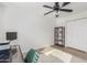 Bright home office features built-in shelving and a ceiling fan at 6808 E Loma Land Dr, Scottsdale, AZ 85257
