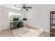 Home office with wood floors and built-in shelving at 6808 E Loma Land Dr, Scottsdale, AZ 85257
