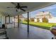 Covered patio with ceiling fan, hot tub, and backyard access at 6808 E Loma Land Dr, Scottsdale, AZ 85257