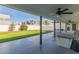 Covered patio with ceiling fan, hot tub, and backyard access at 6808 E Loma Land Dr, Scottsdale, AZ 85257
