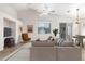 Virtually staged living room with beige couch and arm chair at 7238 S 38Th Pl, Phoenix, AZ 85042