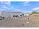 Large backyard with gravel landscaping and a storage shed at 7648 E Holmes Ave, Mesa, AZ 85209