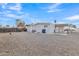 Fenced backyard with gravel, a patio, and utility area at 7648 E Holmes Ave, Mesa, AZ 85209