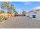 Backyard with gravel, a wooden fence, and desert plants at 7648 E Holmes Ave, Mesa, AZ 85209