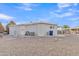 Spacious backyard with gravel and a clothesline at 7648 E Holmes Ave, Mesa, AZ 85209