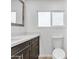 Updated bathroom with modern vanity and toilet at 7648 E Holmes Ave, Mesa, AZ 85209