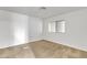 Bright bedroom with neutral walls and carpet flooring at 7648 E Holmes Ave, Mesa, AZ 85209