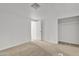 Well-lit bedroom with neutral walls and carpet flooring at 7648 E Holmes Ave, Mesa, AZ 85209