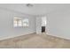 Cozy carpeted bedroom with access to bathroom at 7648 E Holmes Ave, Mesa, AZ 85209