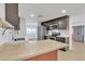 Modern kitchen with butcher block island and dark cabinetry at 7648 E Holmes Ave, Mesa, AZ 85209