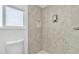 Clean shower with updated tile and built-in shelving at 7648 E Holmes Ave, Mesa, AZ 85209