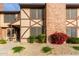 Brick townhouse exterior with landscaping and walkway at 7905 W Thunderbird Rd # 309, Peoria, AZ 85381