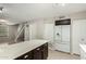 Kitchen with island and view of staircase at 7905 W Thunderbird Rd # 309, Peoria, AZ 85381