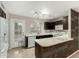 Modern kitchen with island and wood accent wall at 7905 W Thunderbird Rd # 309, Peoria, AZ 85381