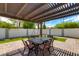 Outdoor patio area with pergola, seating, and artificial turf at 8219 N 3Rd Ave, Phoenix, AZ 85021
