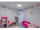 bedroom with pink accents and toys at 8219 N 3Rd Ave, Phoenix, AZ 85021