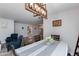 Bright dining room with chandelier and view into kitchen at 8219 N 3Rd Ave, Phoenix, AZ 85021