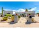 White single story home with landscaped front yard, gated entry and two car garage at 8219 N 3Rd Ave, Phoenix, AZ 85021
