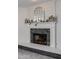 Modern fireplace with a white mantel and gray stone surround at 8219 N 3Rd Ave, Phoenix, AZ 85021