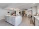 Modern kitchen with island, stainless steel appliances, and adjacent dining area at 8219 N 3Rd Ave, Phoenix, AZ 85021