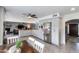 Open kitchen with breakfast bar, stainless steel appliances, and views to dining area at 8219 N 3Rd Ave, Phoenix, AZ 85021