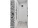 Modern shower with textured walls and mosaic tile accents at 8219 N 3Rd Ave, Phoenix, AZ 85021
