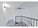 Clean hallway with wood-look floors and modern railing at 1051 S Dobson Rd # 165, Mesa, AZ 85202