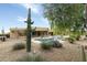 Landscaped backyard featuring a pool, cactus, and mountain views at 10630 E Cactus View Cir, Gold Canyon, AZ 85118