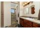 Bathroom with walk-in shower, wood vanity, and slate floor at 10630 E Cactus View Cir, Gold Canyon, AZ 85118