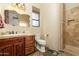 Bathroom with walk-in shower, wood vanity, and slate floor at 10630 E Cactus View Cir, Gold Canyon, AZ 85118