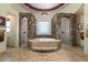 Large bathroom with stone walls, a bathtub, and walk-in shower at 10630 E Cactus View Cir, Gold Canyon, AZ 85118