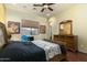 Bedroom with wood floors, and ensuite bathroom at 10630 E Cactus View Cir, Gold Canyon, AZ 85118