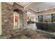 Stone entryway with arched passage leading to living area and kitchen at 10630 E Cactus View Cir, Gold Canyon, AZ 85118