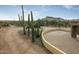 Landscaped yard with cacti and a brick paved driveway at 10630 E Cactus View Cir, Gold Canyon, AZ 85118