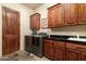 Laundry room features ample storage and modern appliances at 10630 E Cactus View Cir, Gold Canyon, AZ 85118