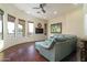 Living room with large sectional sofa and hardwood floors at 10630 E Cactus View Cir, Gold Canyon, AZ 85118