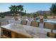 Granite countertop outdoor kitchen with pool and mountain views at 10630 E Cactus View Cir, Gold Canyon, AZ 85118