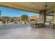 Outdoor kitchen with mountain views and pool access at 10630 E Cactus View Cir, Gold Canyon, AZ 85118