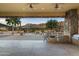 Outdoor kitchen with built-in grill and bar, overlooking the pool and mountains at 10630 E Cactus View Cir, Gold Canyon, AZ 85118