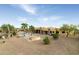 Spacious backyard with a pool, fire pit, and desert landscaping at 10630 E Cactus View Cir, Gold Canyon, AZ 85118