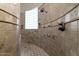 Walk-in shower with multiple shower heads and glass block window at 10630 E Cactus View Cir, Gold Canyon, AZ 85118